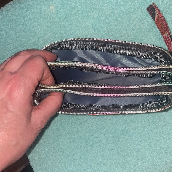 This cute little nylon wristlet with 3 zip pockets is NWOT’s - Picture 4 of 6